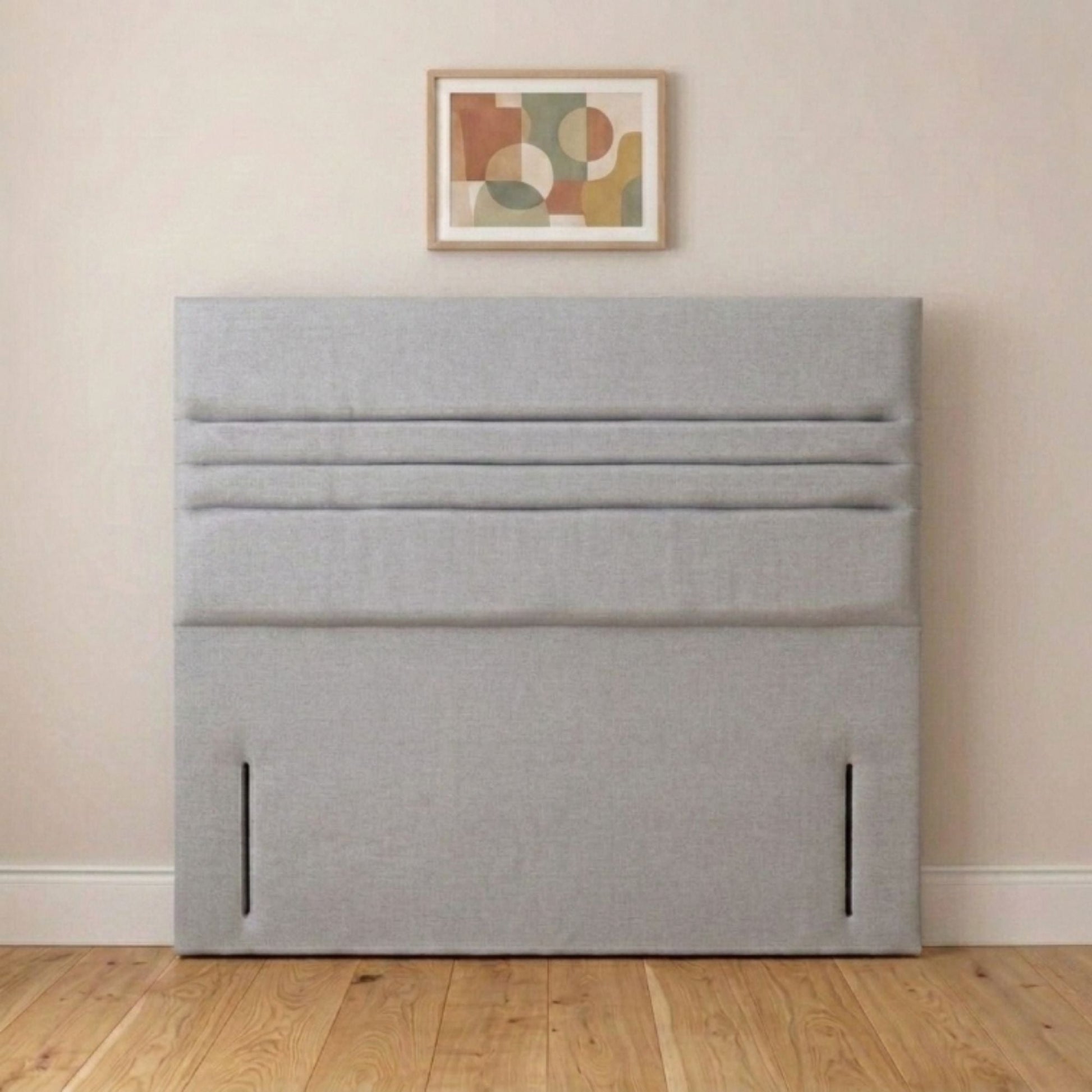 Cream horizontal panel headboard angled view showing wide padded panels