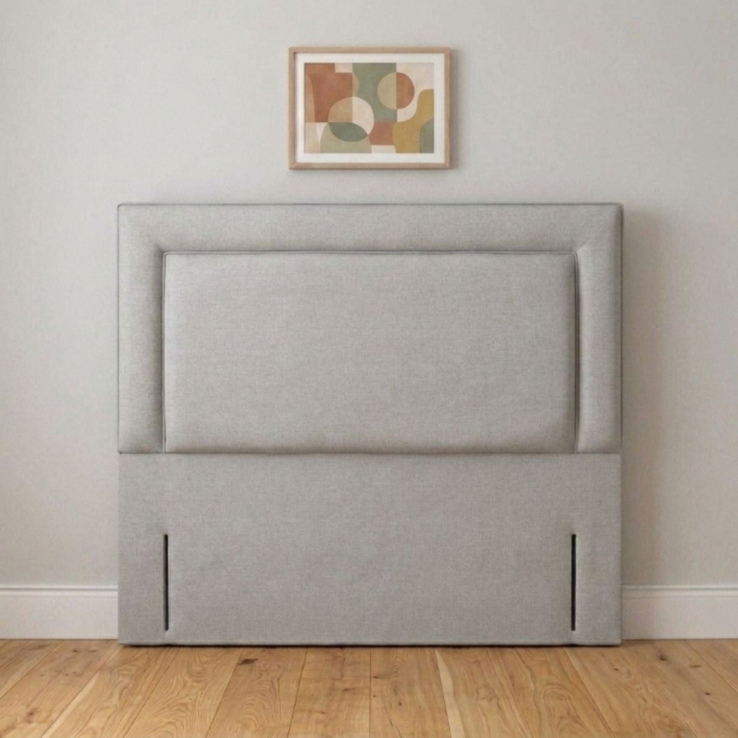 Cream framed headboard angled view showing upholstered border