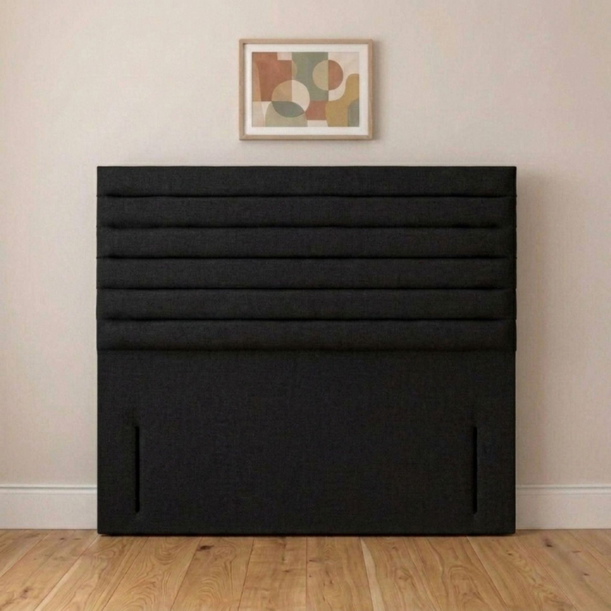 Slim horizontal panel upholstered headboard close-up of cream fabric